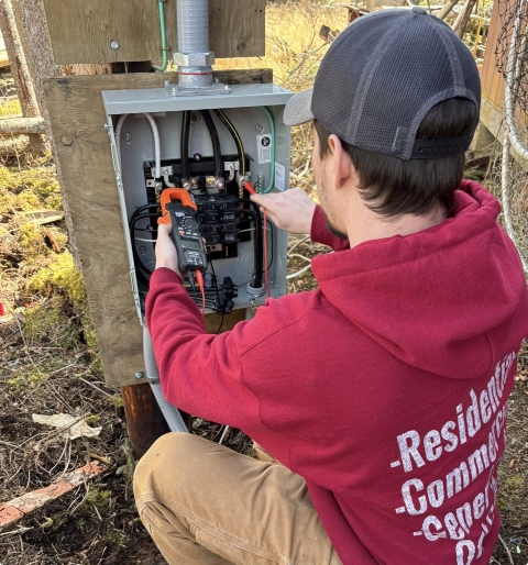 Residential home under construction — rough-in wiring and framing for new build or addition