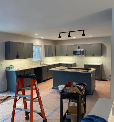 Residential home under construction — rough-in wiring and framing for new build or addition